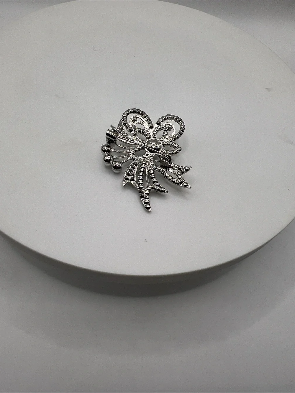 474. Silver Tone and Aurora Borealis Crystal Floral Brooch With Pearl Accents.